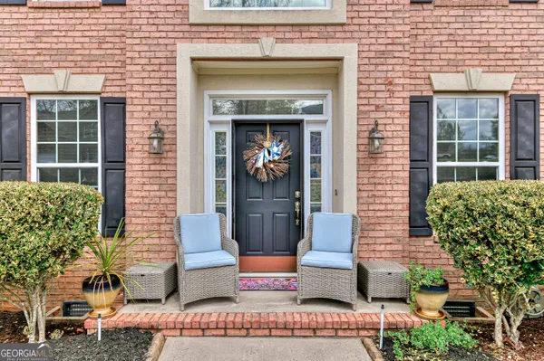 a front view of a house with garden