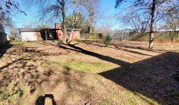 a view of a backyard of the house