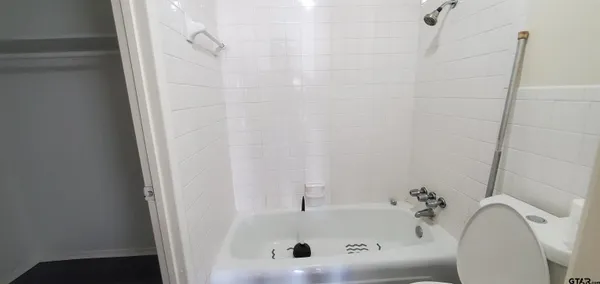 a bathroom with a sink and shower