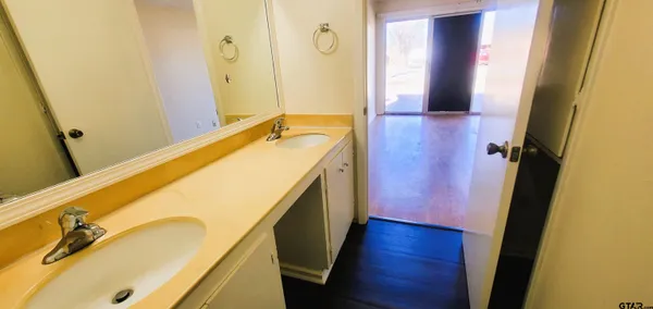 a bathroom with a sink and a mirror
