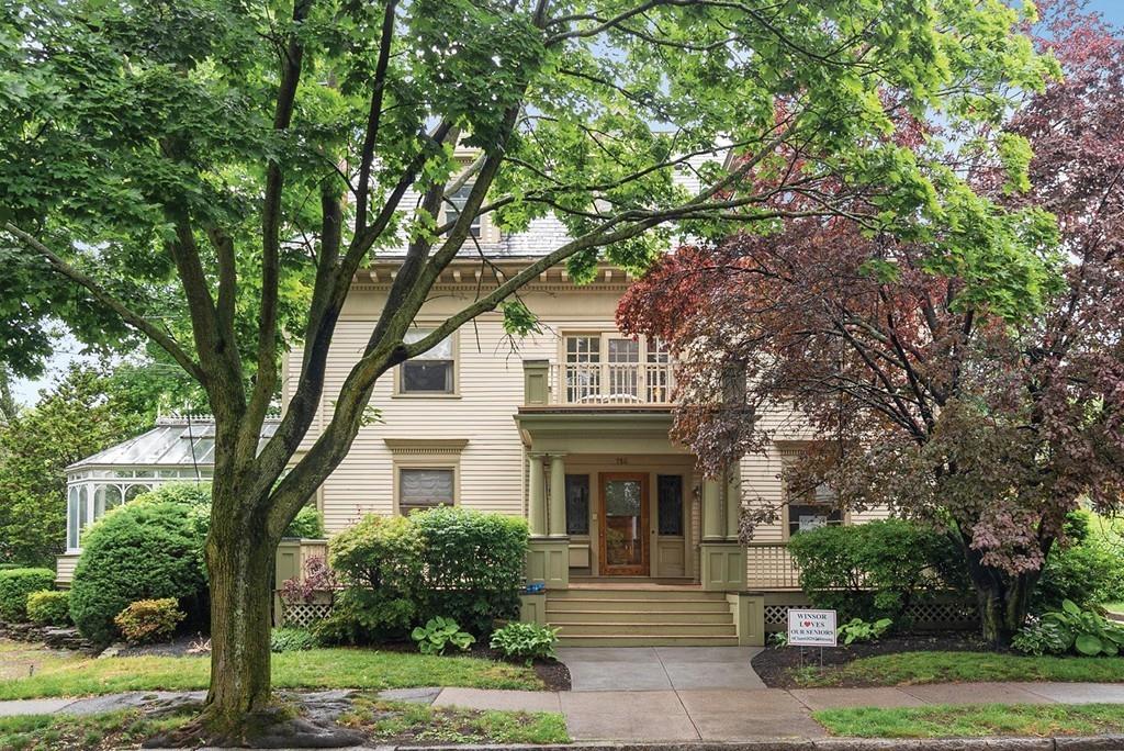 114 Naples Road Brookline, MA 02446 - Photo 1 of 24 a front view of a house with a garden