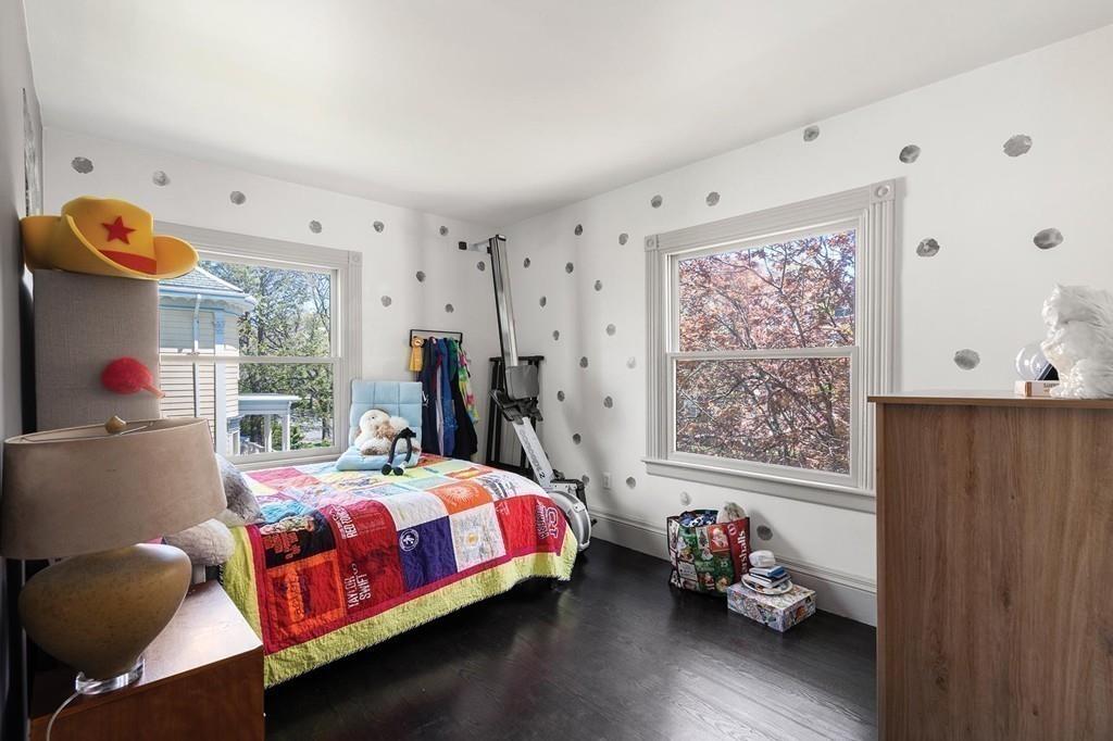 114 Naples Road Brookline, MA 02446 - Photo 17 of 24 a bedroom with furniture and a window