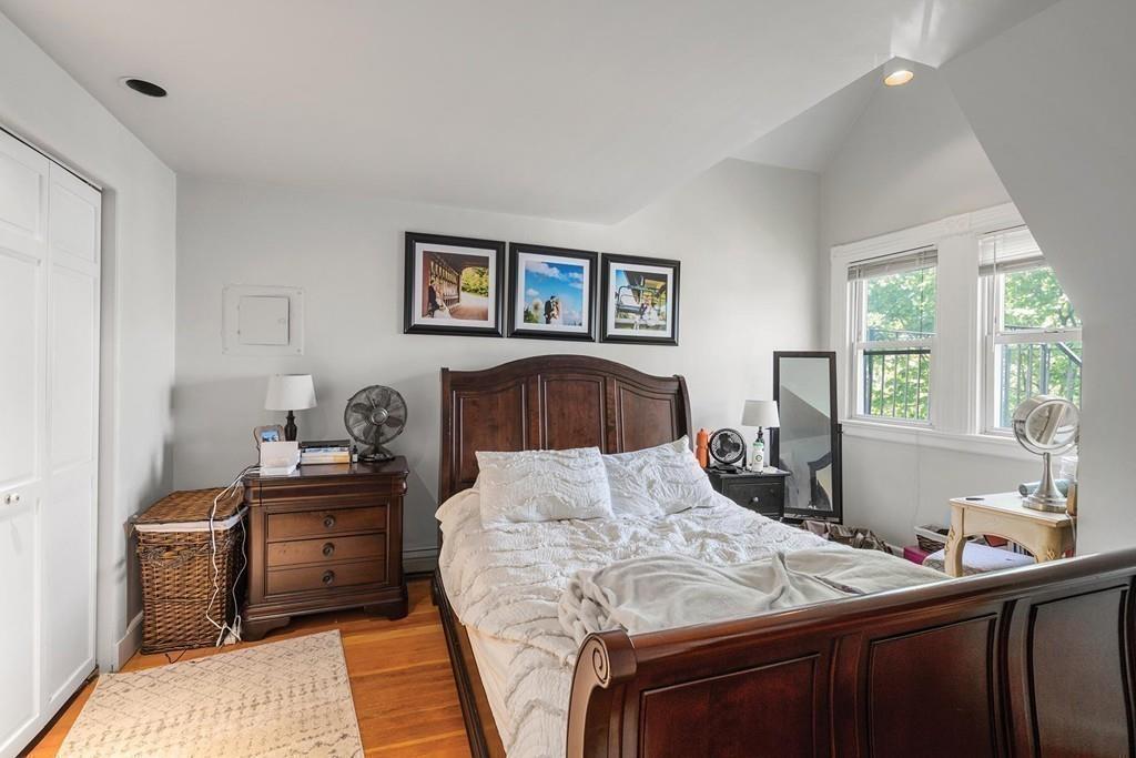 114 Naples Road Brookline, MA 02446 - Photo 18 of 24 a bedroom with a bed and a window