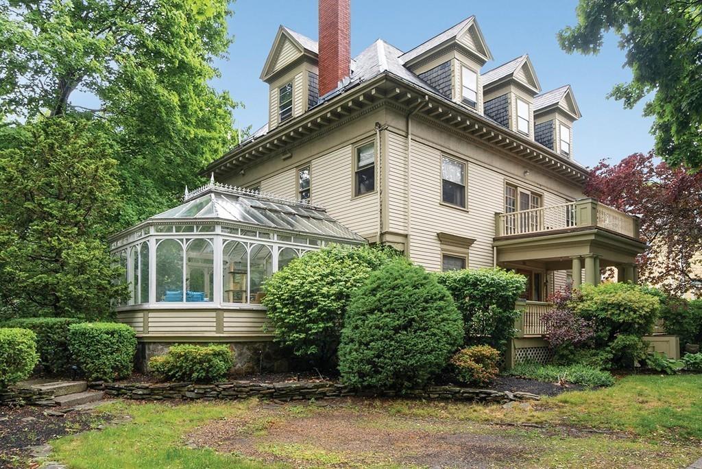 114 Naples Road Brookline, MA 02446 - Photo 2 of 24 a front view of a house with a yard
