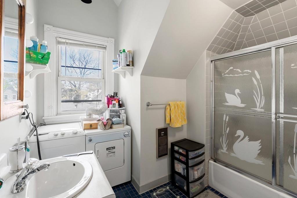 114 Naples Road Brookline, MA 02446 - Photo 23 of 24 a bathroom with a sink toilet and shower