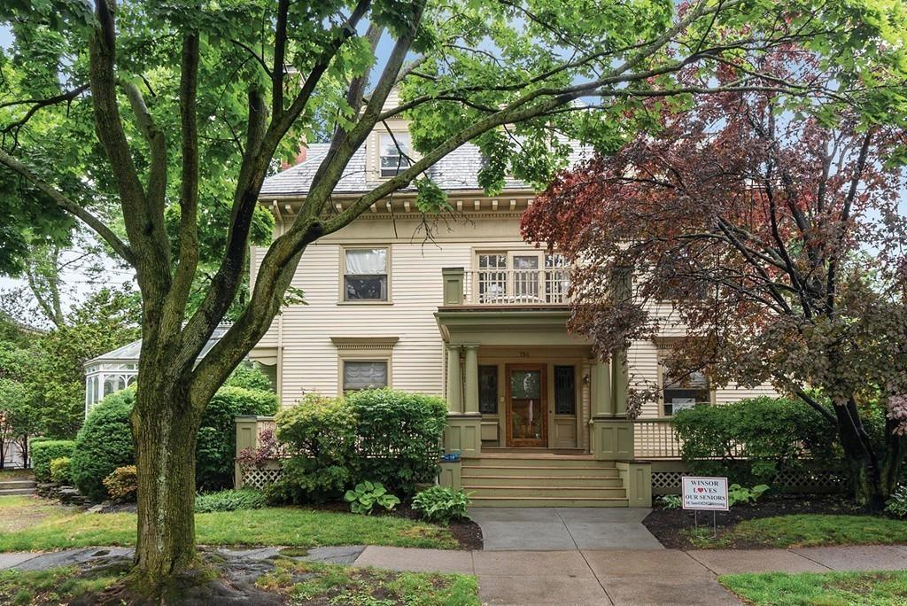 114 Naples Road Brookline, MA 02446 - Photo 24 of 24 a front view of a house with a garden
