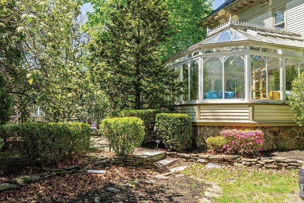 114 Naples Road Brookline, MA 02446 - Photo 3 of 24 a view of a house with potted plants