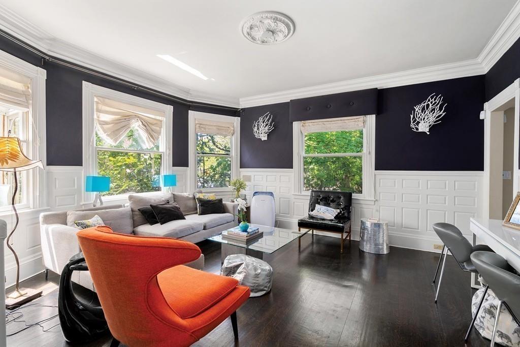 114 Naples Road Brookline, MA 02446 - Photo 6 of 24 a living room with furniture and a large window