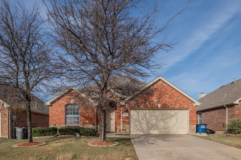 front view of a house with a trees