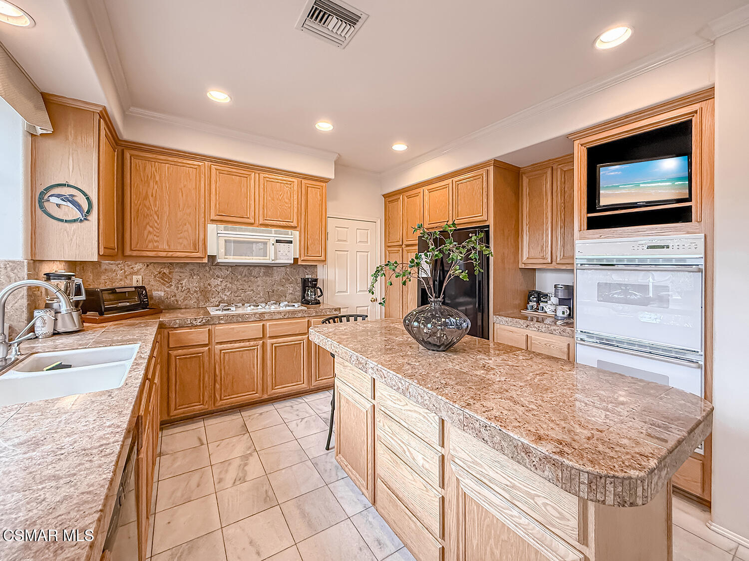 260 Sycamore Ridge Street Simi Valley, CA 93065 - Photo 24 of 59 a kitchen with stainless steel appliances granite countertop a sink stove and cabinets