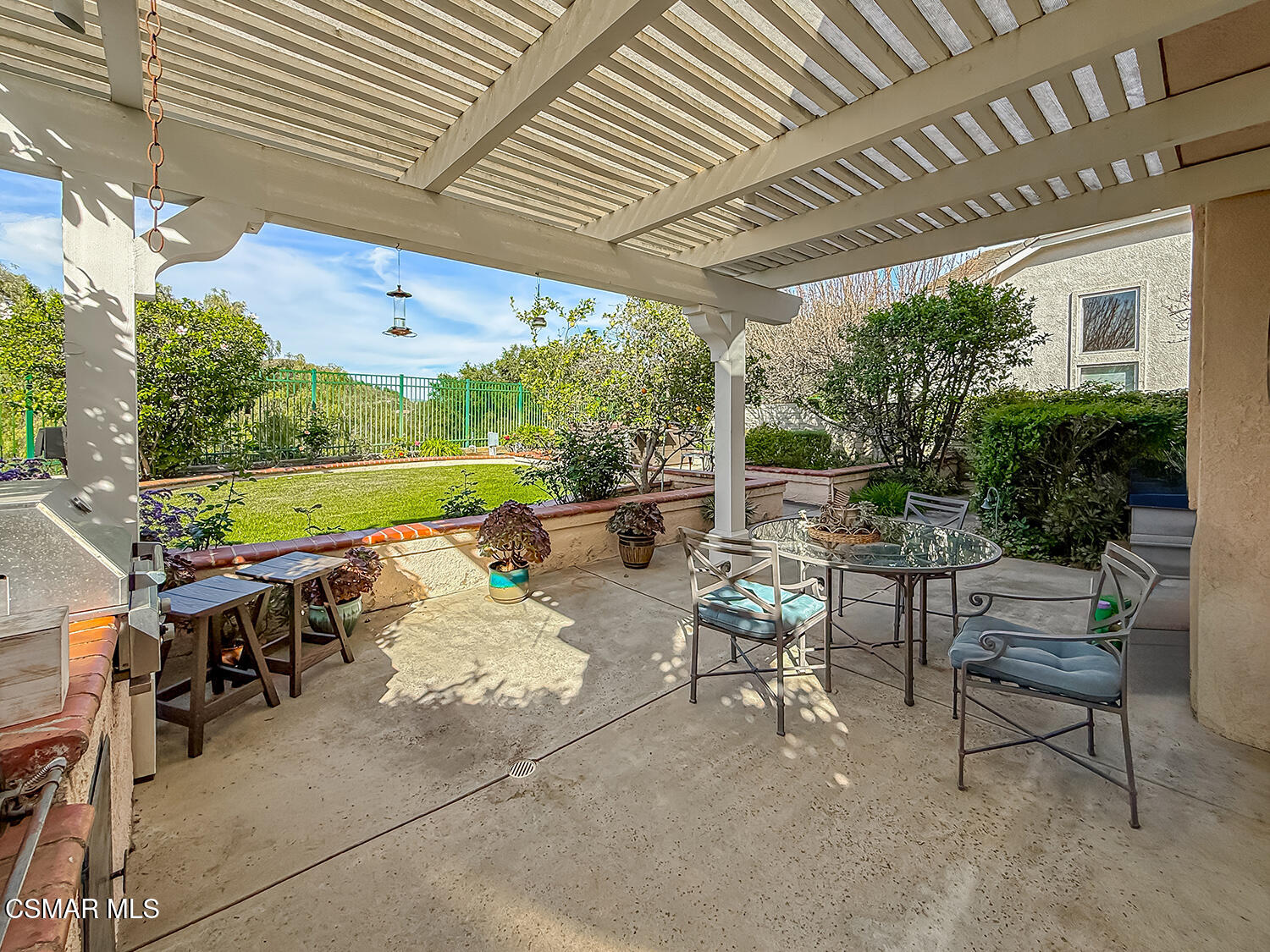 260 Sycamore Ridge Street Simi Valley, CA 93065 - Photo 52 of 59 a view of a patio with table and chairs potted plants