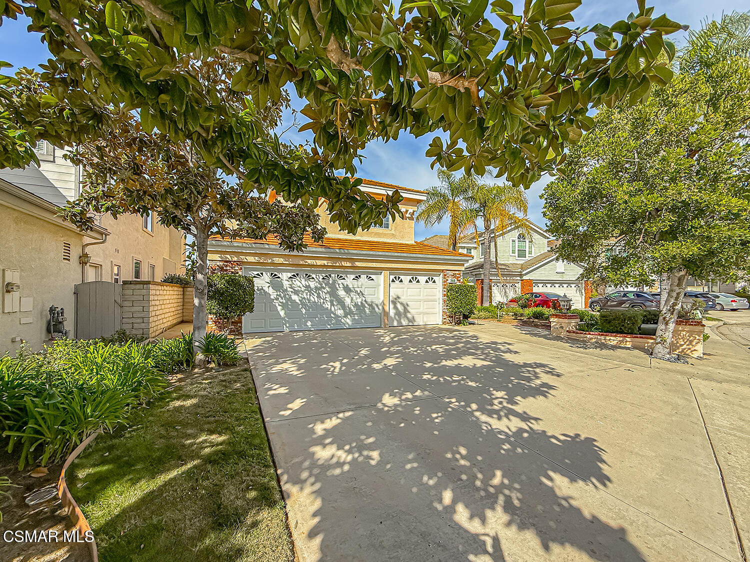260 Sycamore Ridge Street Simi Valley, CA 93065 - Photo 7 of 59 a front view of a building with a garden