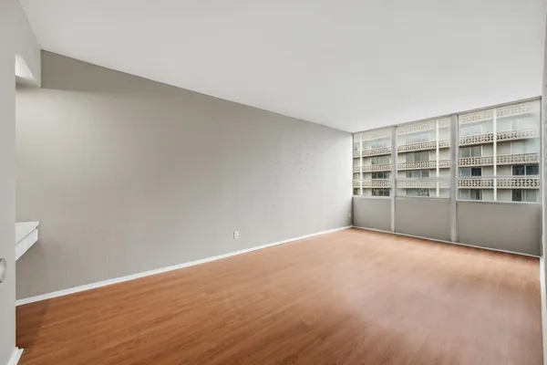 a view of an empty room with a window