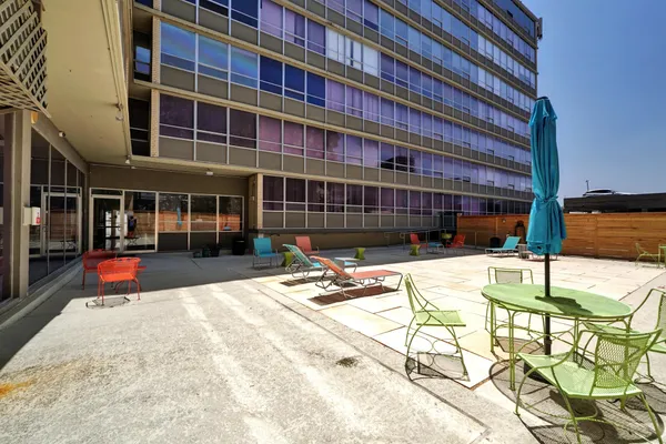 a view of a swimming pool with a patio