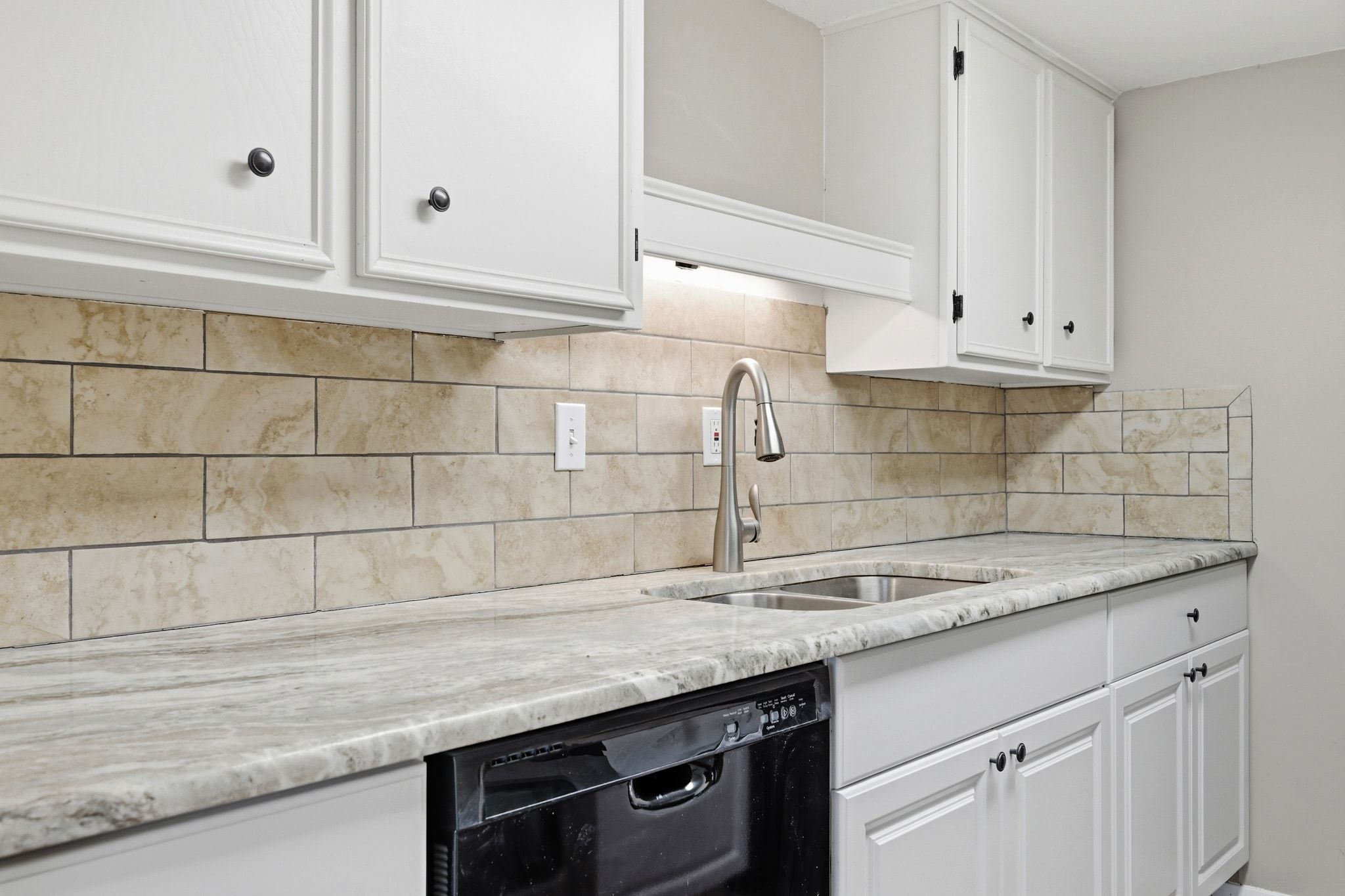 1800 Lavaca Street, Unit 515 Austin, TX 78701 - Photo 2 of 20 a kitchen with granite countertop a sink and cabinets