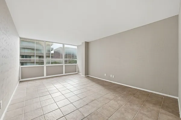 a view of an empty room with a window