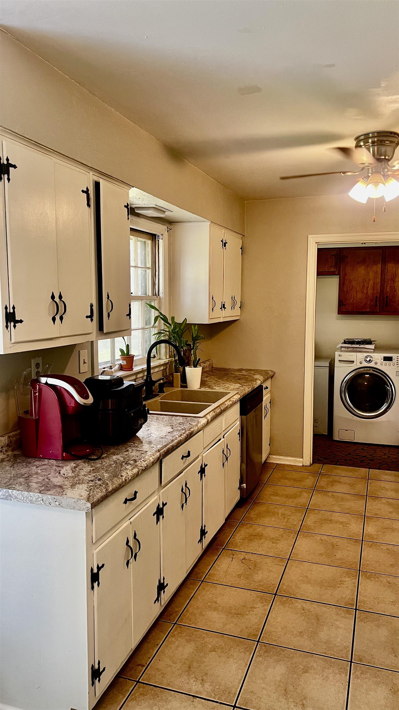 3122 Kirkcaldy Road Memphis, TN 38128 - Photo 14 of 16 Kitchen featuring ceiling fan, light tile flooring, sink, separate washer and dryer, and white cabinetry