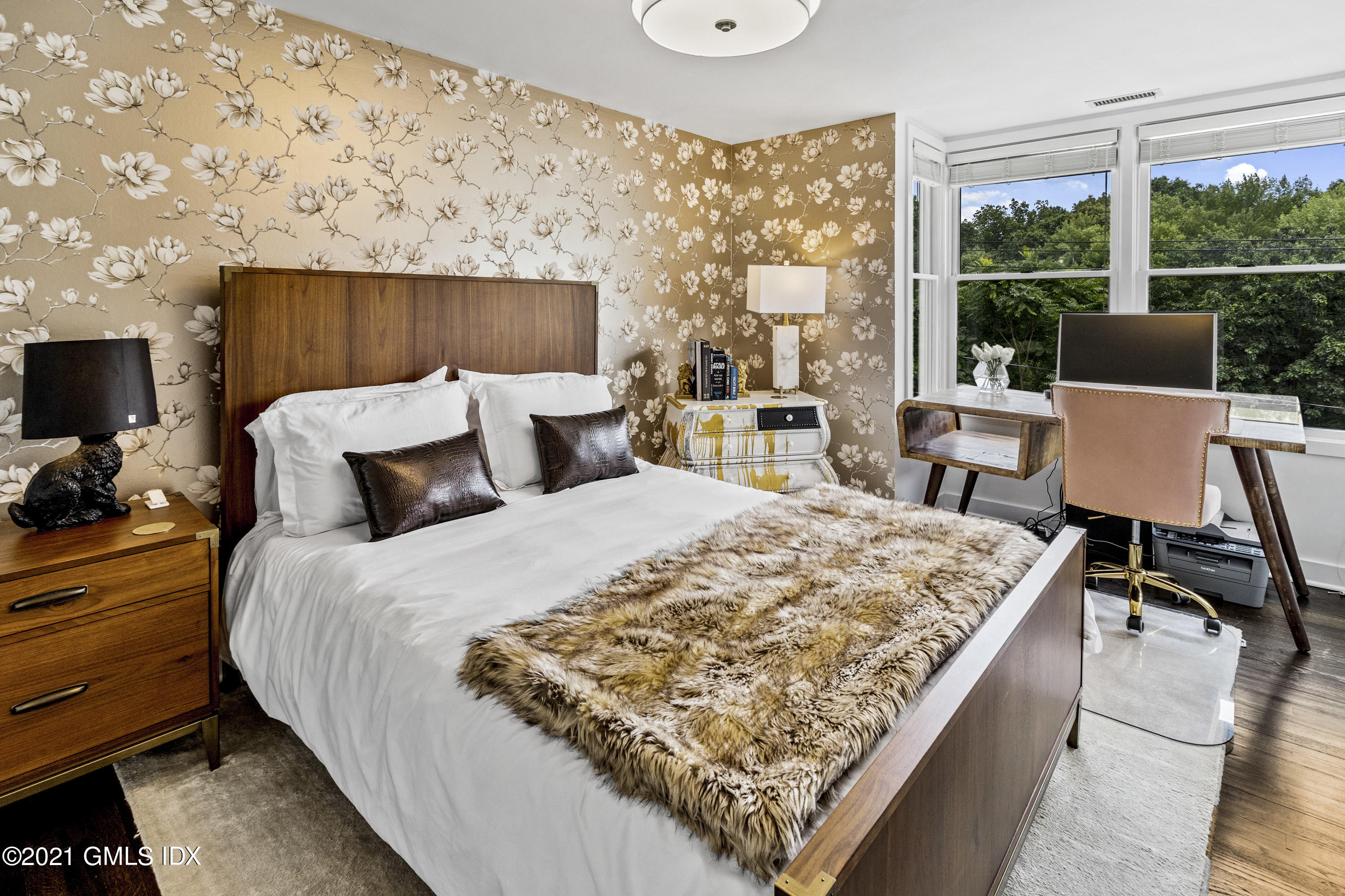 316 Valley Road Cos Cob, CT 06807 - Photo 16 of 25 a bed sitting in a bedroom next to a window with lamp on table and a flat screen tv