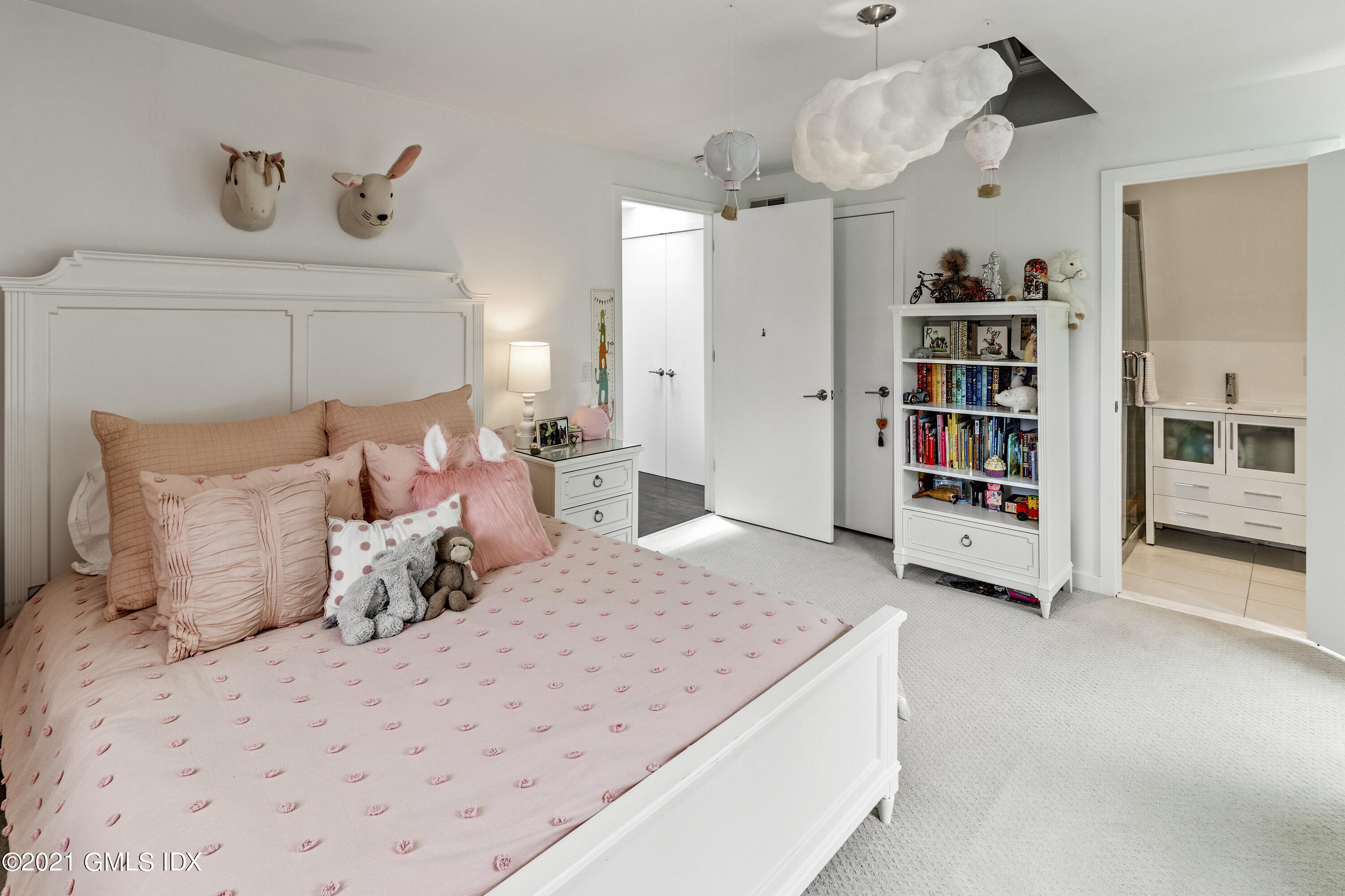 316 Valley Road Cos Cob, CT 06807 - Photo 18 of 25 a bedroom with a bed and cabinets