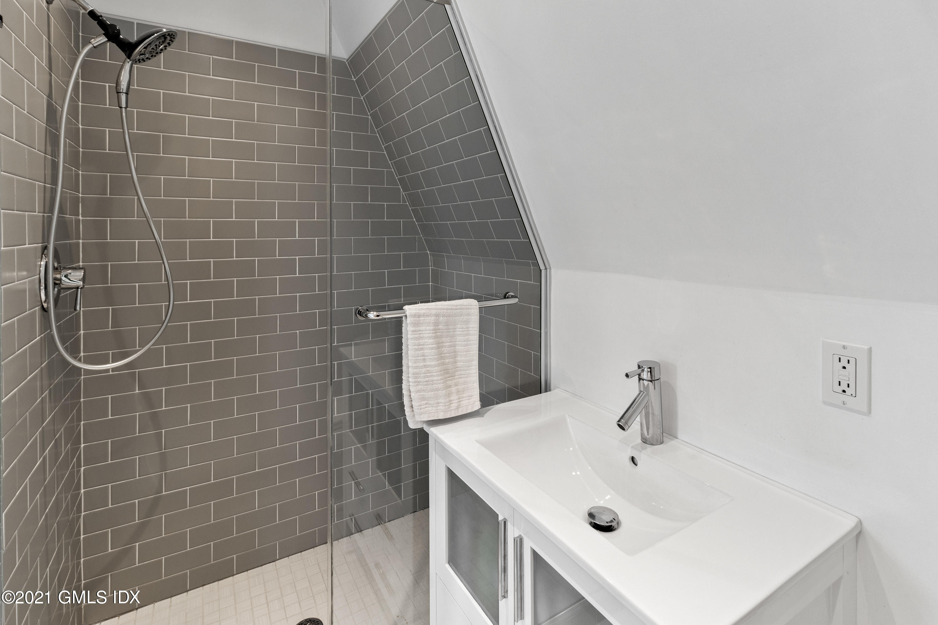 316 Valley Road Cos Cob, CT 06807 - Photo 19 of 25 a bathroom with a sink a toilet and shower