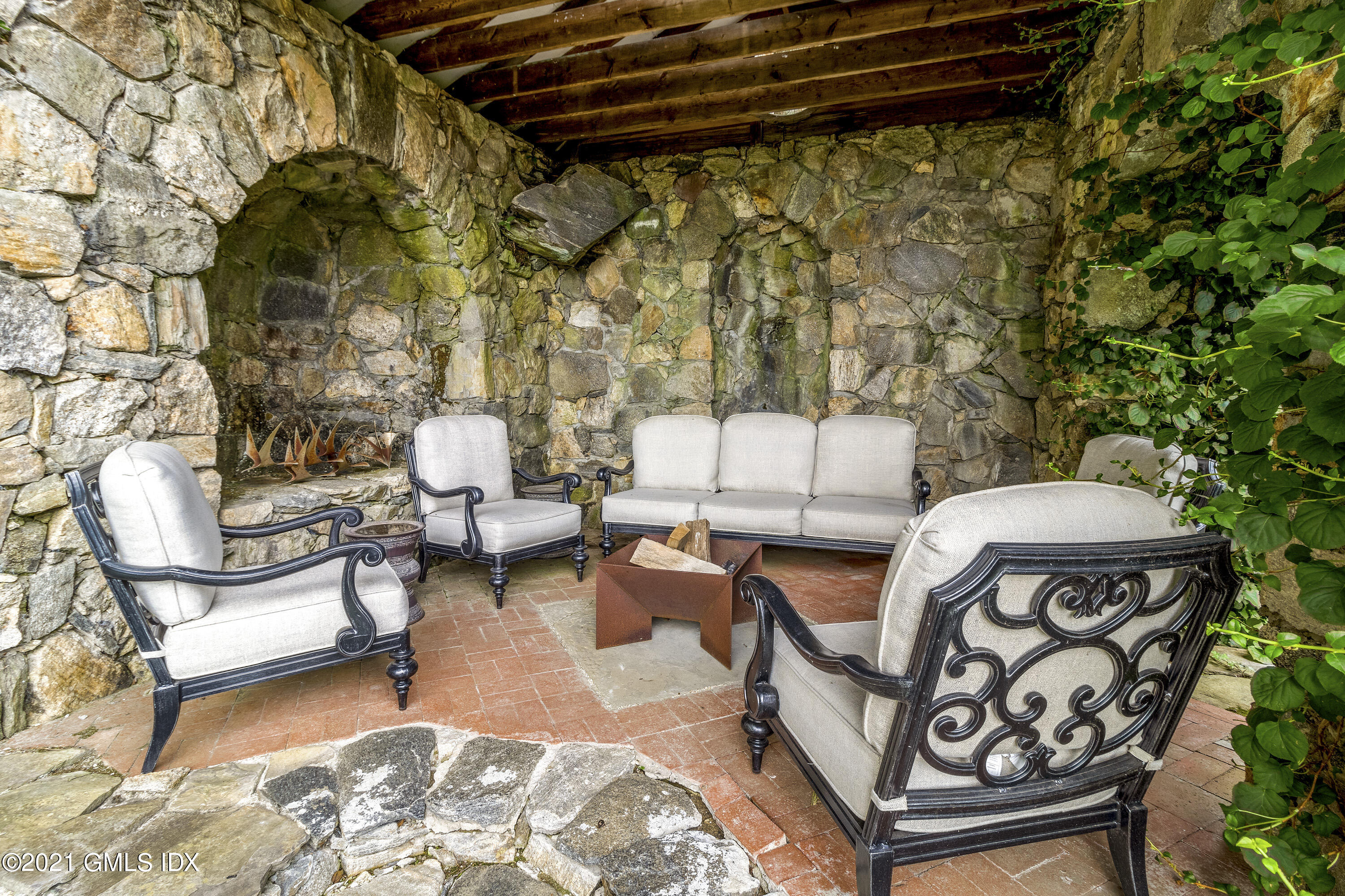 316 Valley Road Cos Cob, CT 06807 - Photo 2 of 25 a outdoor living space with furniture and a rug