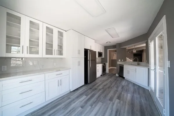 a kitchen with a refrigerator a sink and dishwasher