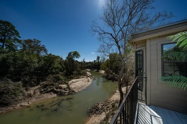 a view of a lake in middle of forest