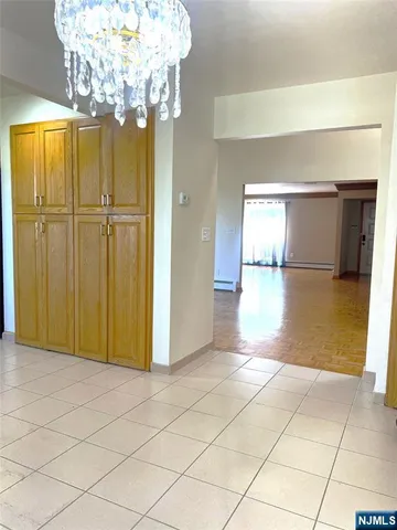 a view of a hallway with a chandelier