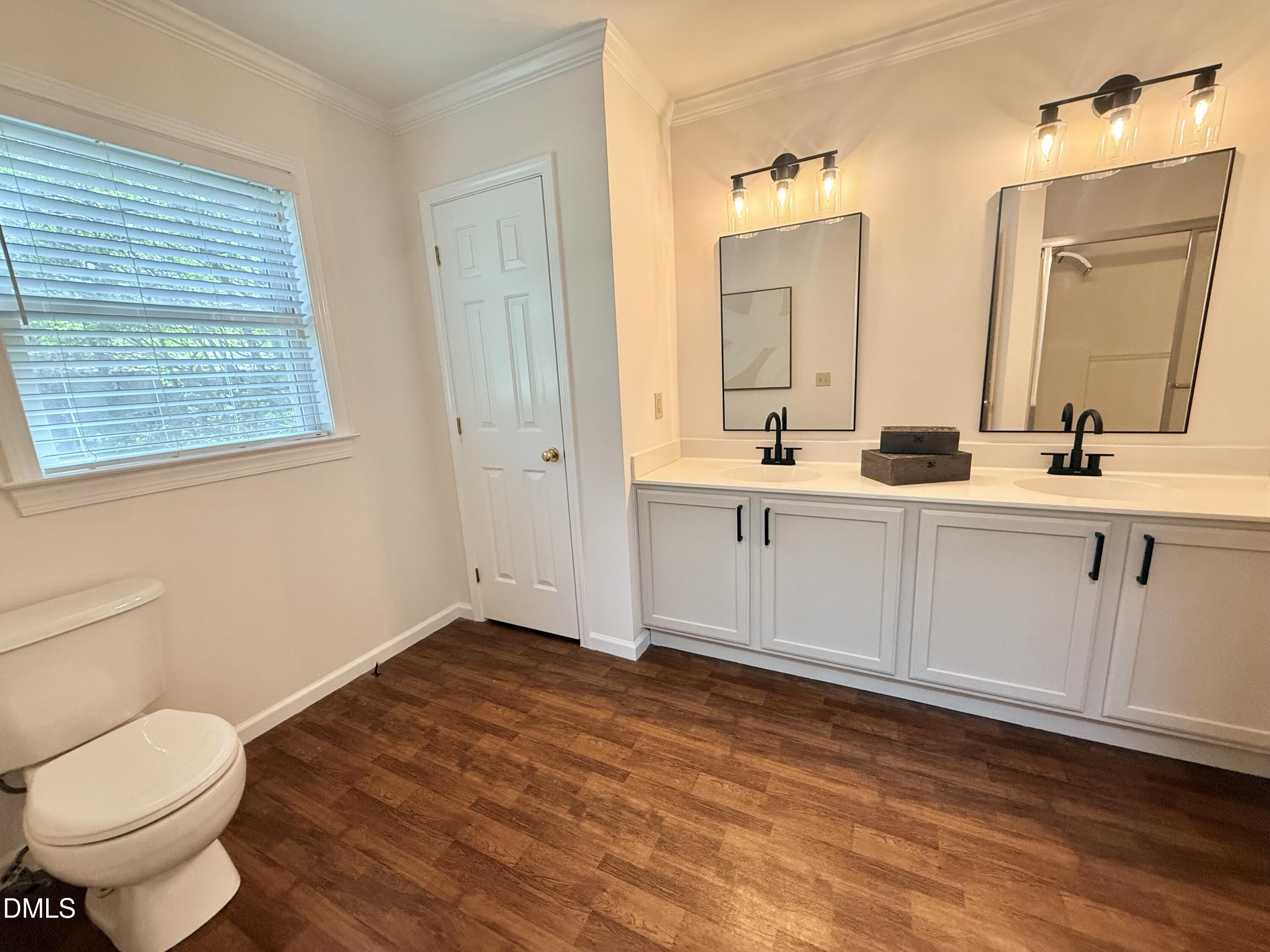 2429 Halifax Road Roxboro, NC 27573 - Photo 36 of 54 a bathroom with a toilet sink and mirror
