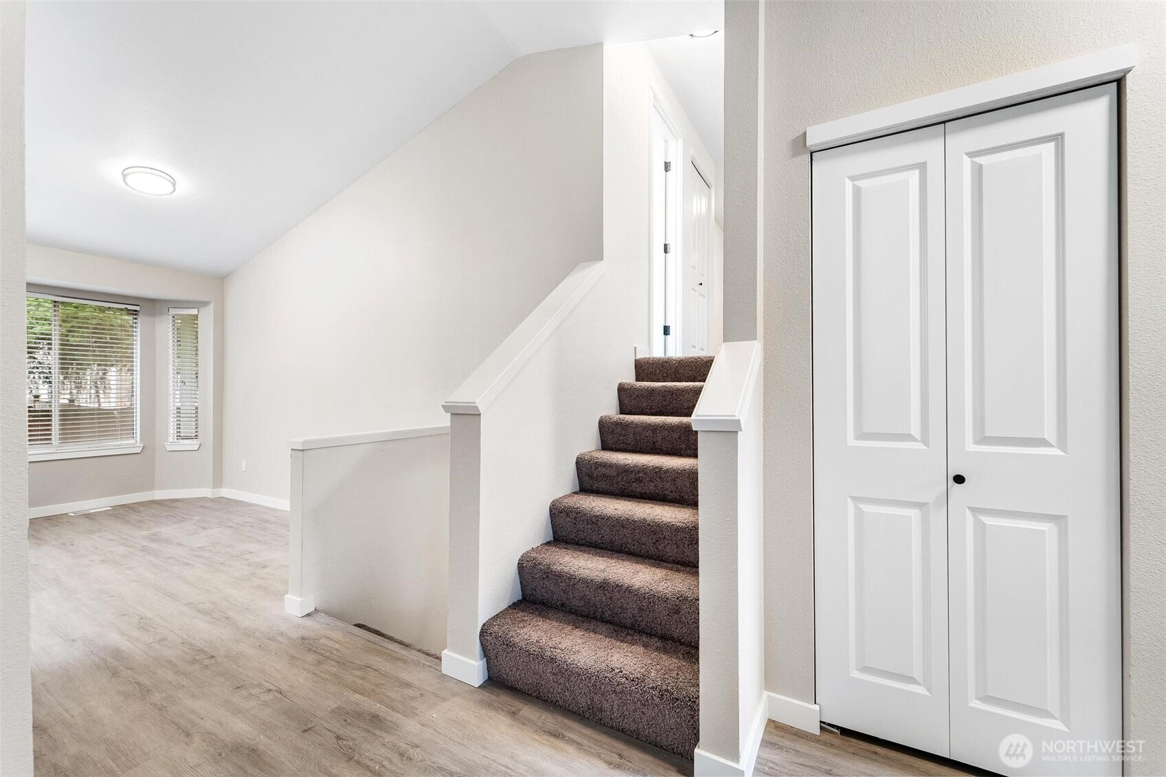 604 213th Street Southwest Bothell, WA 98021 - Photo 16 of 40 a view of entryway and hall with wooden floor