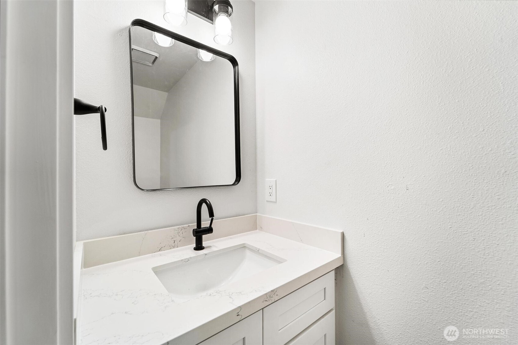 604 213th Street Southwest Bothell, WA 98021 - Photo 19 of 40 a bathroom with a sink and mirror
