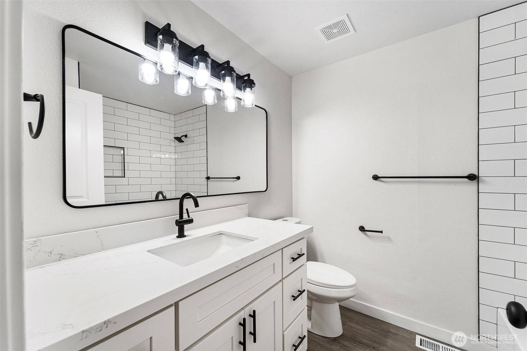 604 213th Street Southwest Bothell, WA 98021 - Photo 21 of 40 a bathroom with a sink a toilet and shower