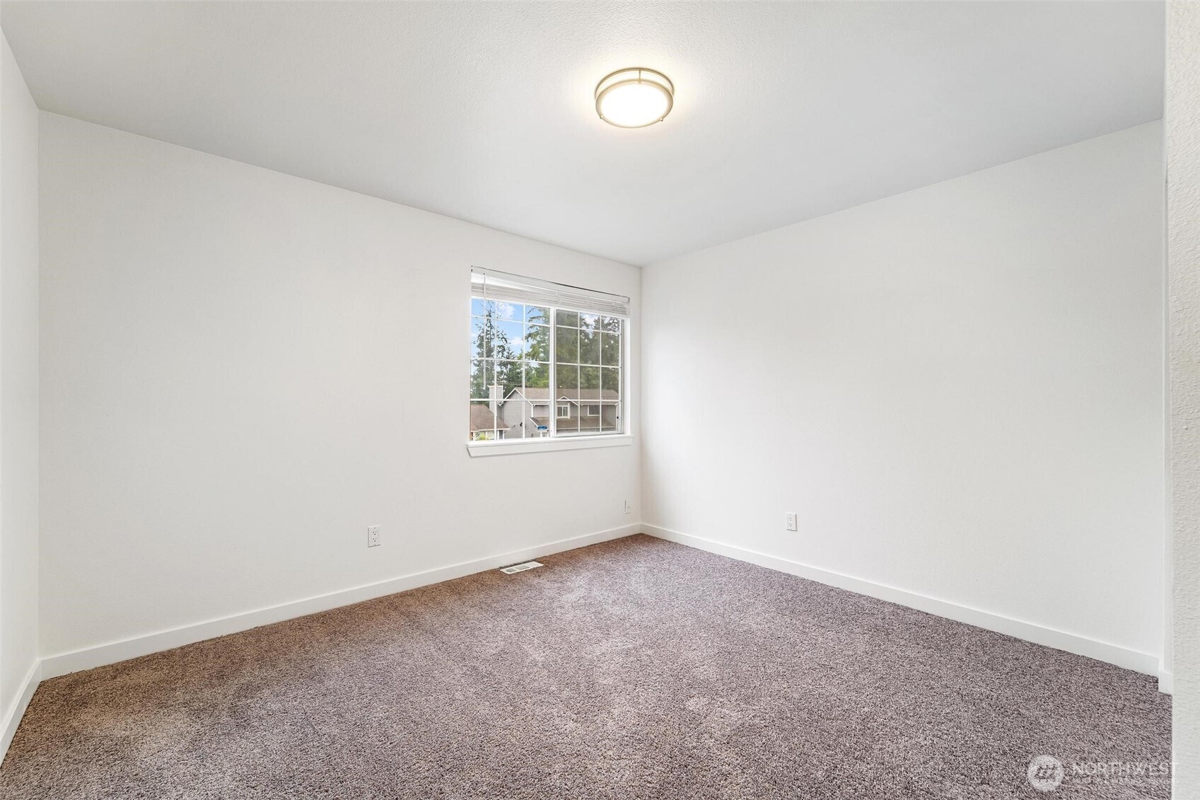 604 213th Street Southwest Bothell, WA 98021 - Photo 23 of 40 an empty room with windows