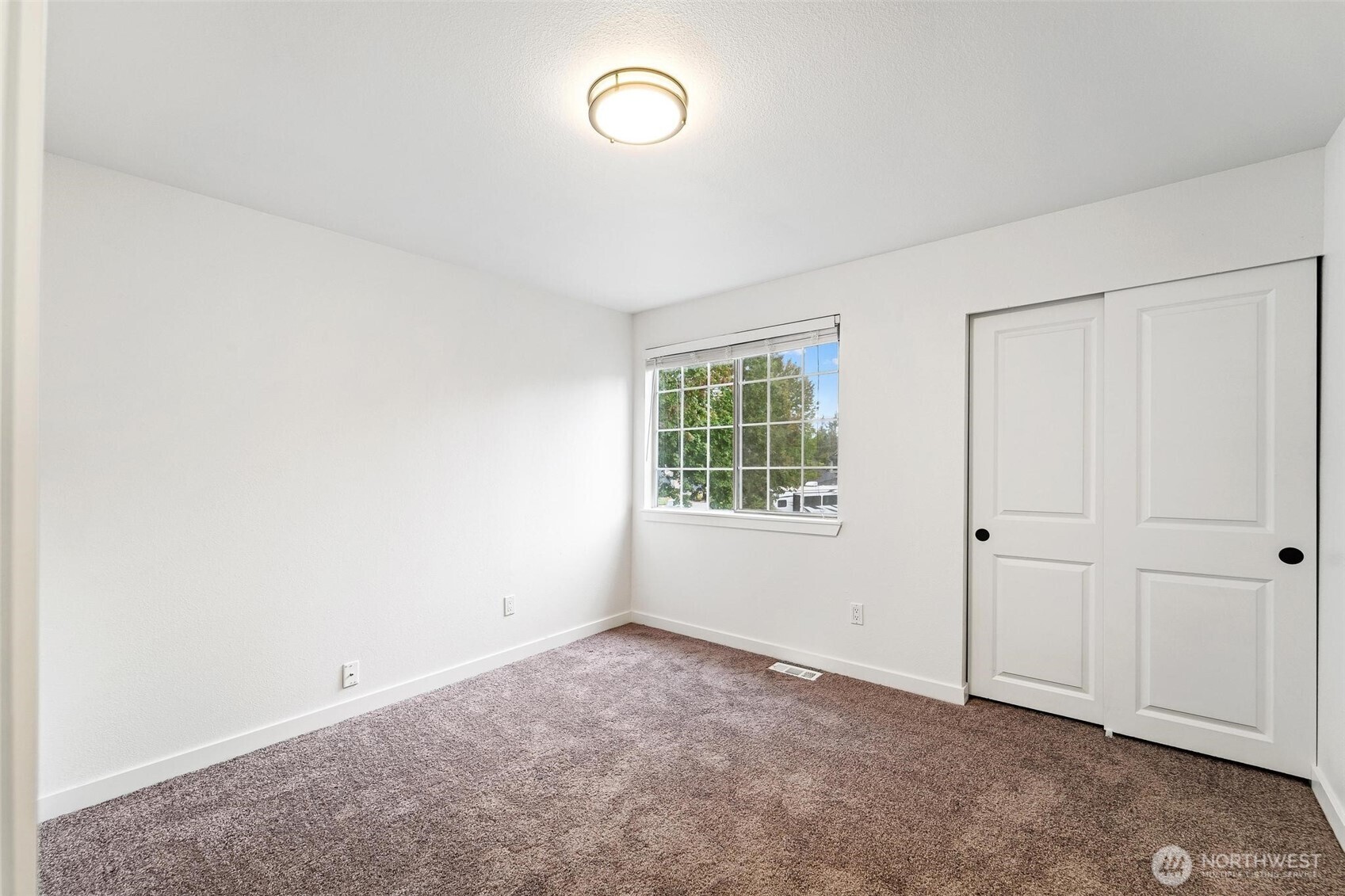 604 213th Street Southwest Bothell, WA 98021 - Photo 24 of 40 an empty room with windows