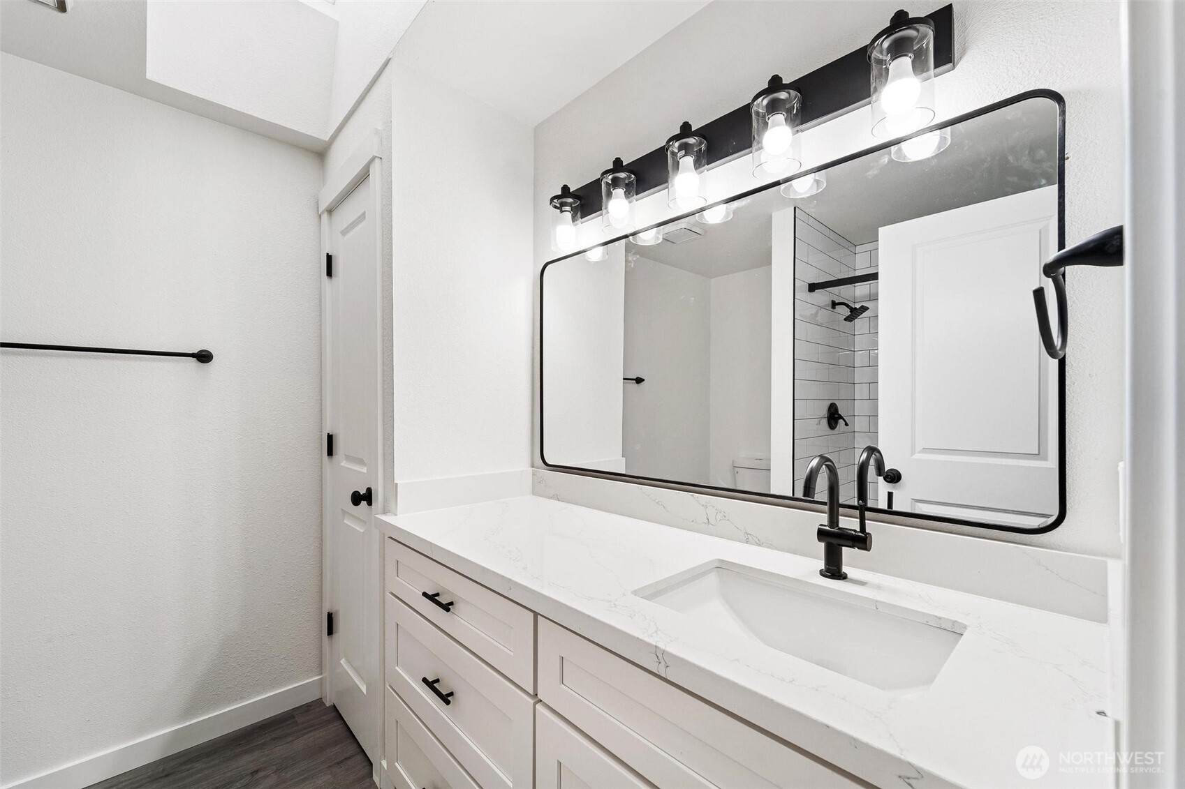 604 213th Street Southwest Bothell, WA 98021 - Photo 28 of 40 a bathroom with a sink and mirror