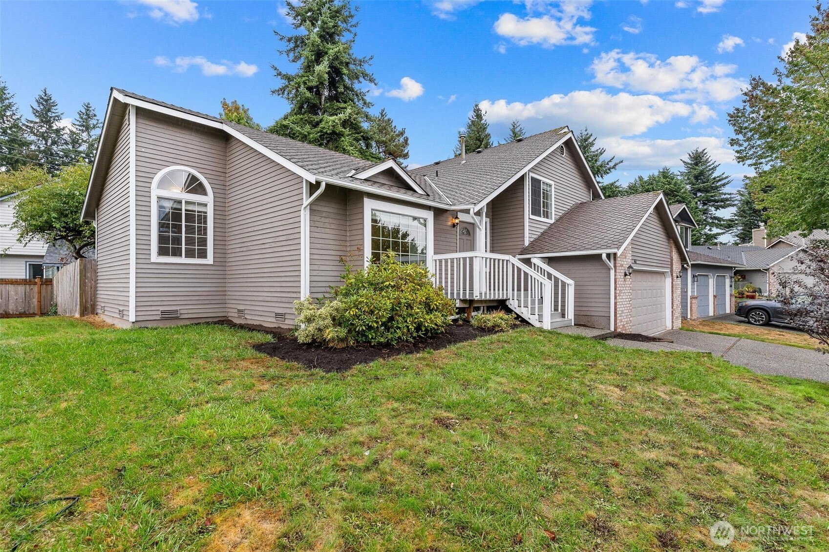 604 213th Street Southwest Bothell, WA 98021 - Photo 4 of 40 a front view of house with yard and green space