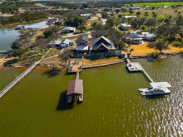 an aerial view of a house with a ocean view