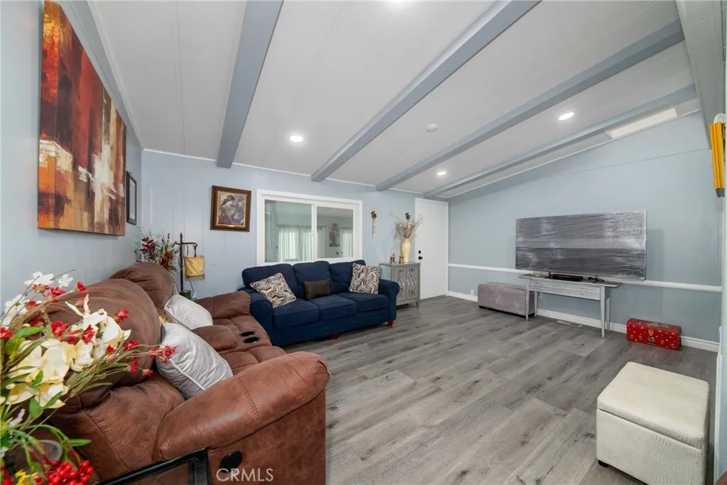 4000 Pierce Street, Unit 58 Riverside, CA 92505 - Photo 11 of 32 a living room with furniture and a flat screen tv