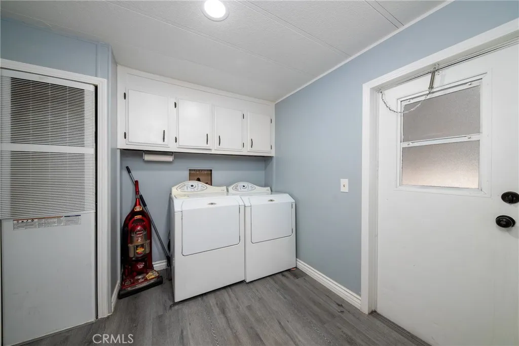 4000 Pierce Street, Unit 58 Riverside, CA 92505 - Photo 16 of 32 a utility room with wooden floor washer and dryer