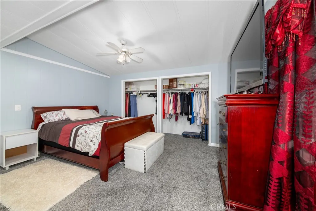 4000 Pierce Street, Unit 58 Riverside, CA 92505 - Photo 18 of 32 a bedroom with a bed and a walk in closet