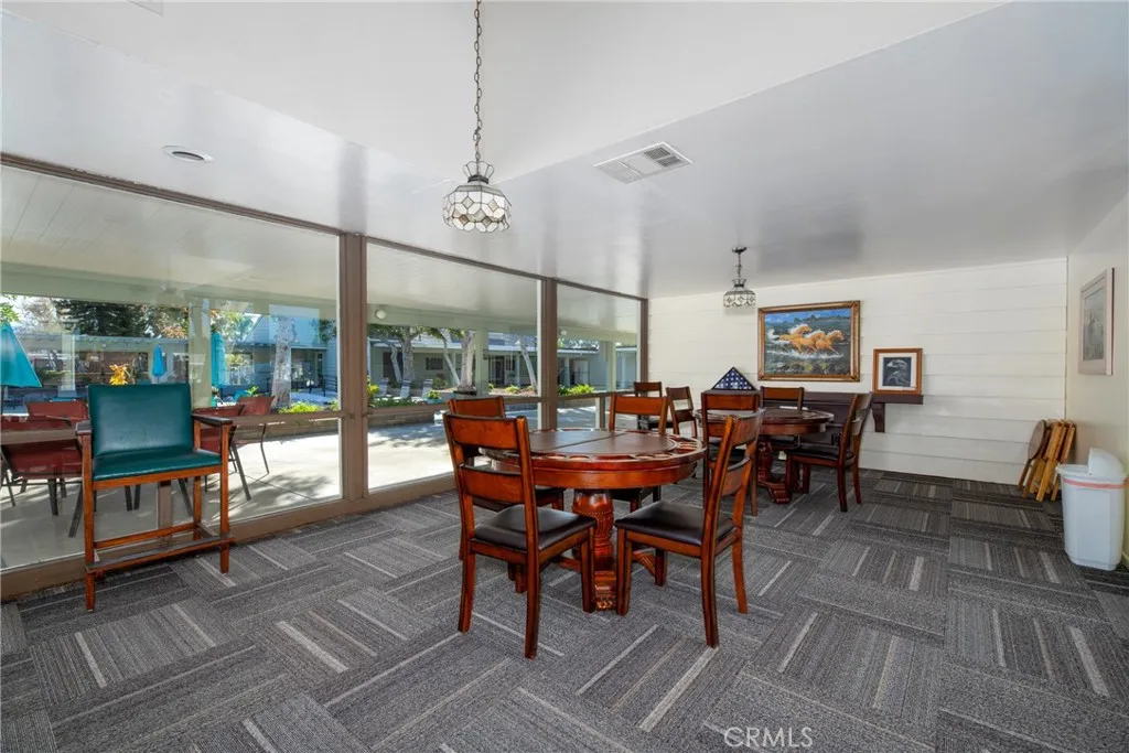 4000 Pierce Street, Unit 58 Riverside, CA 92505 - Photo 25 of 32 a view of a dining room with furniture window and wooden floor