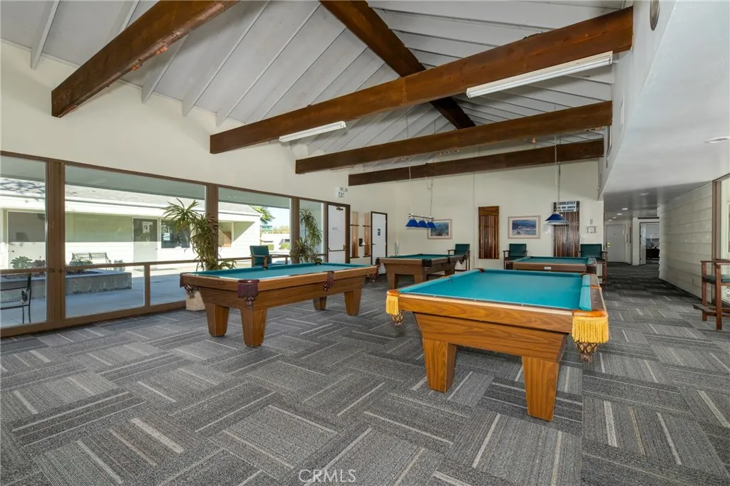 4000 Pierce Street, Unit 58 Riverside, CA 92505 - Photo 27 of 32 a room with lots of furniture and a wooden floor