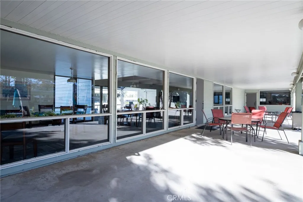 4000 Pierce Street, Unit 58 Riverside, CA 92505 - Photo 28 of 32 a living room with lots of chairs and chandelier