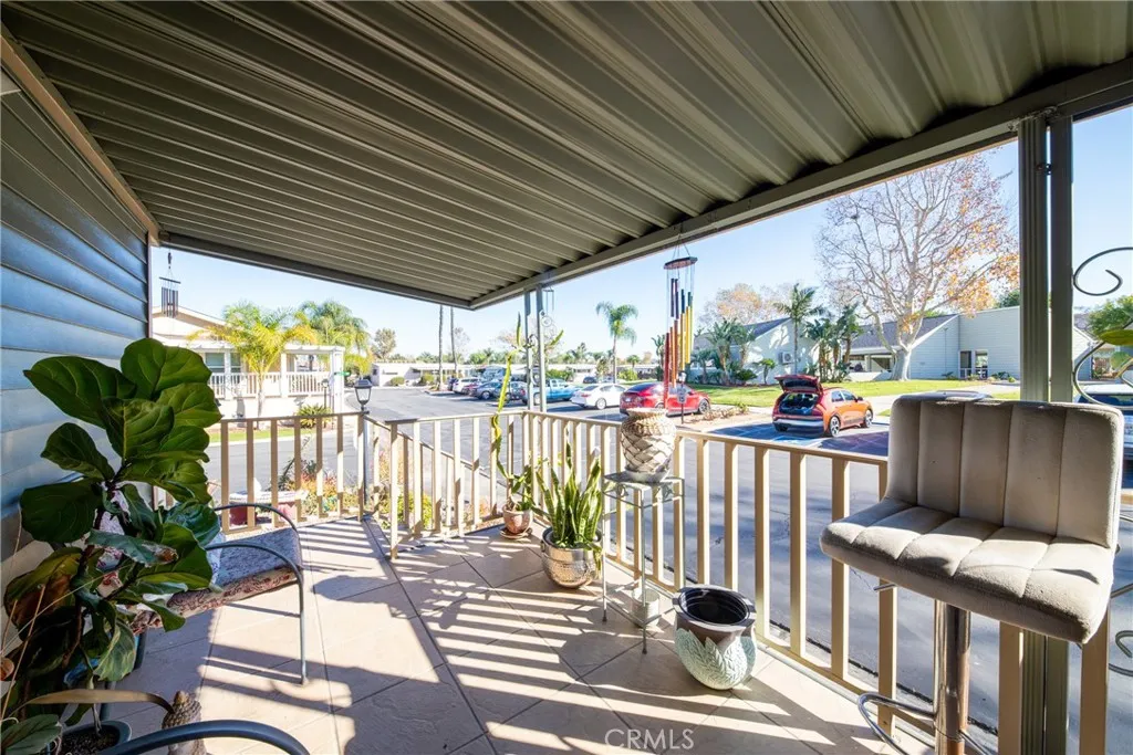 4000 Pierce Street, Unit 58 Riverside, CA 92505 - Photo 8 of 32 a view of a balcony with chairs