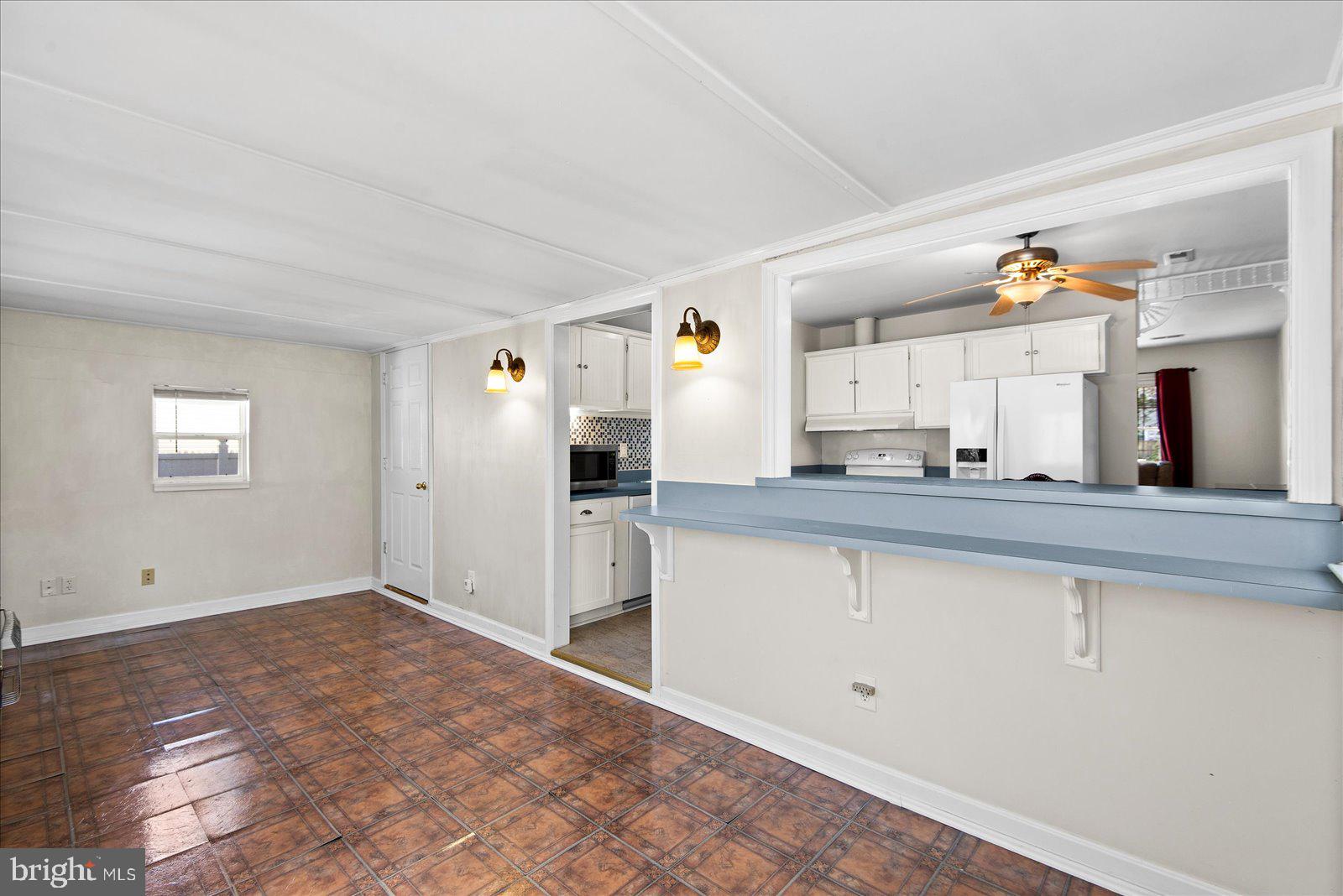 227 7th Street Colonial Beach, VA 22443 - Photo 15 of 36 a large white kitchen with a sink