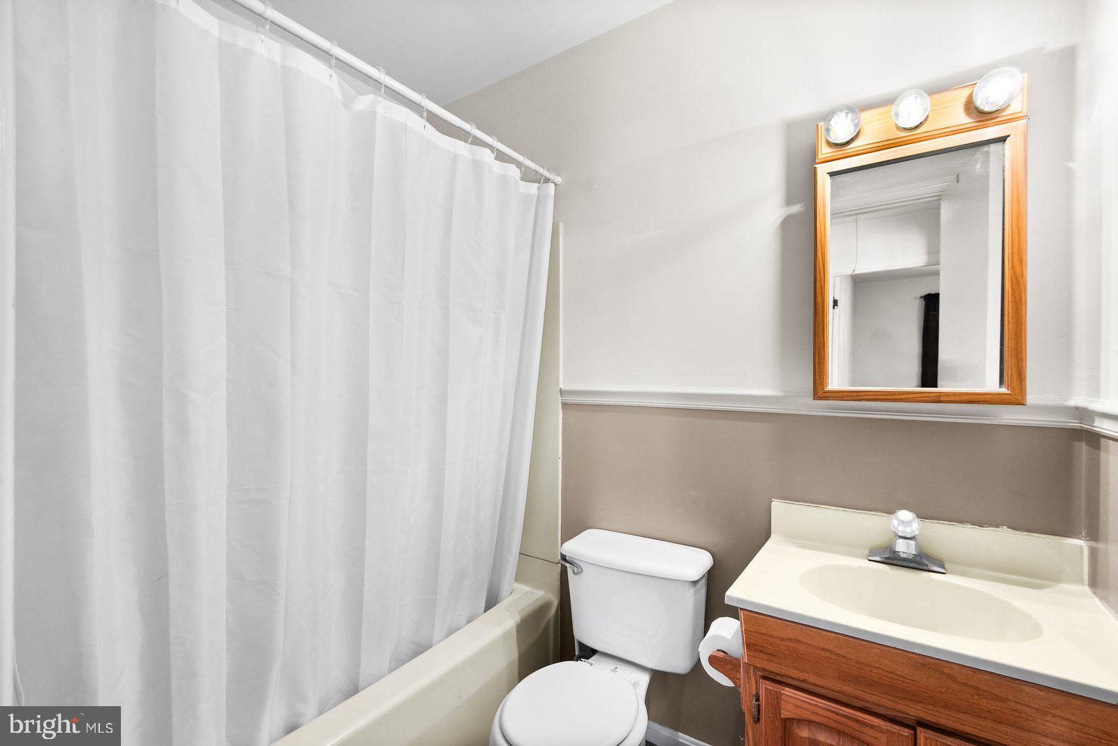 227 7th Street Colonial Beach, VA 22443 - Photo 19 of 36 a bathroom with a sink and a toilet