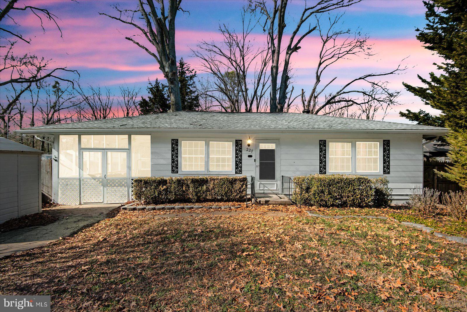 227 7th Street Colonial Beach, VA 22443 - Photo 2 of 36 a front view of a house with a yard