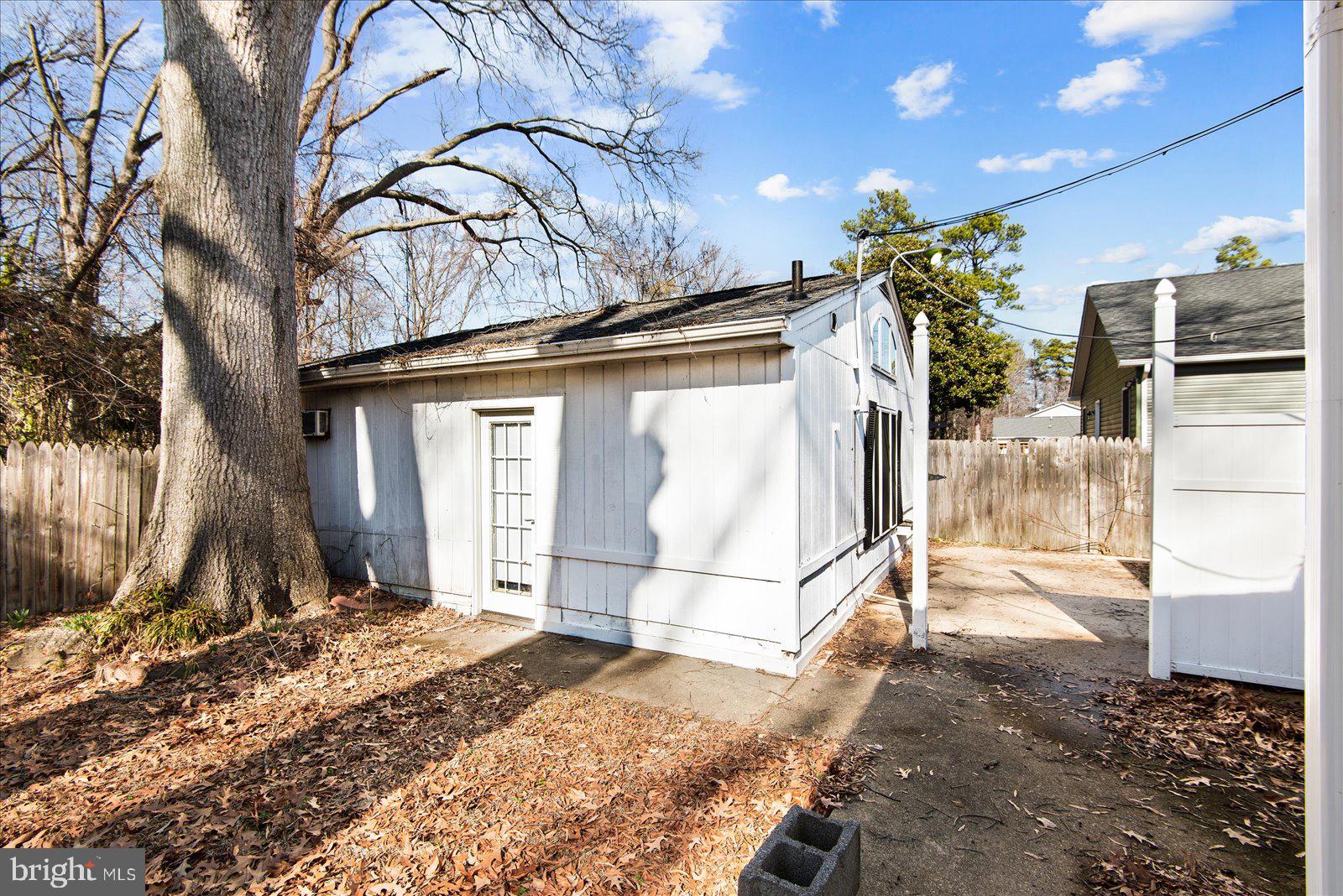 227 7th Street Colonial Beach, VA 22443 - Photo 22 of 36 a view of a house with a snow in the yard