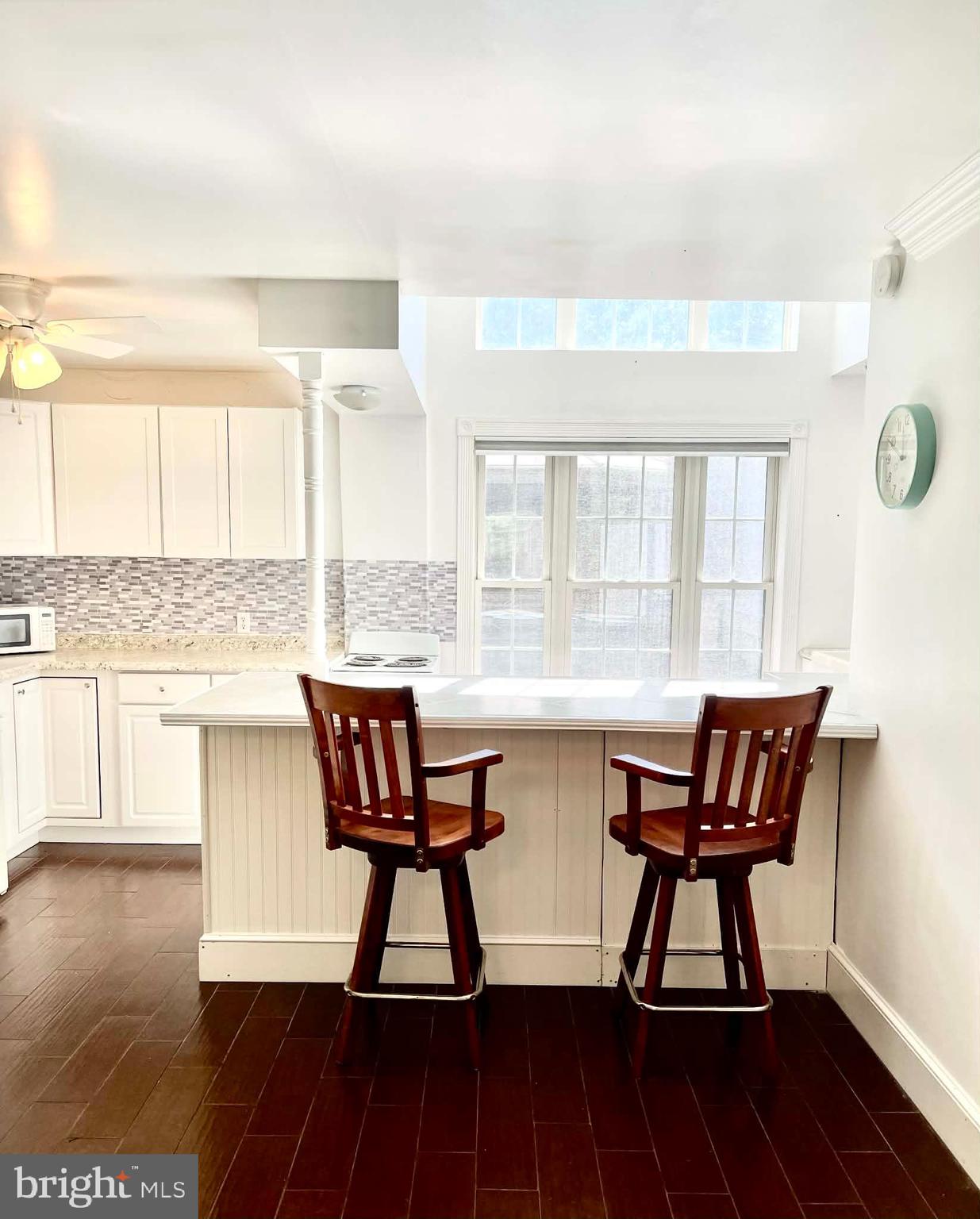 227 7th Street Colonial Beach, VA 22443 - Photo 26 of 36 a view of a dining room with furniture and wooden floor