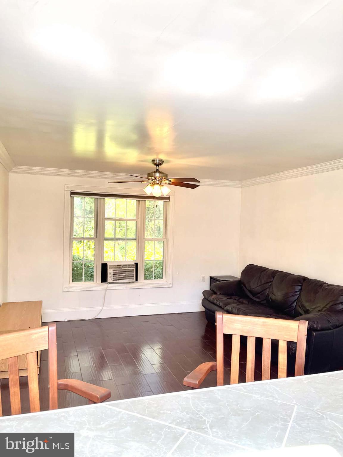 227 7th Street Colonial Beach, VA 22443 - Photo 27 of 36 a living room with furniture and a window